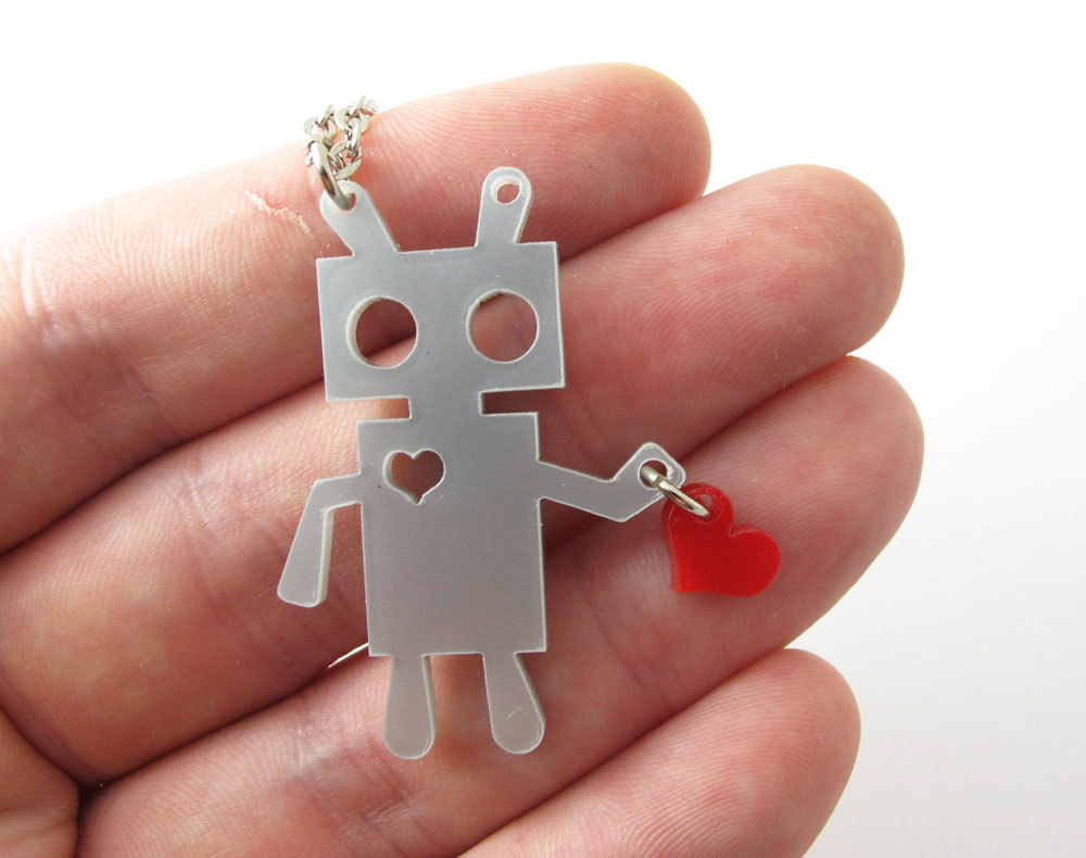 robot holding a heart necklace